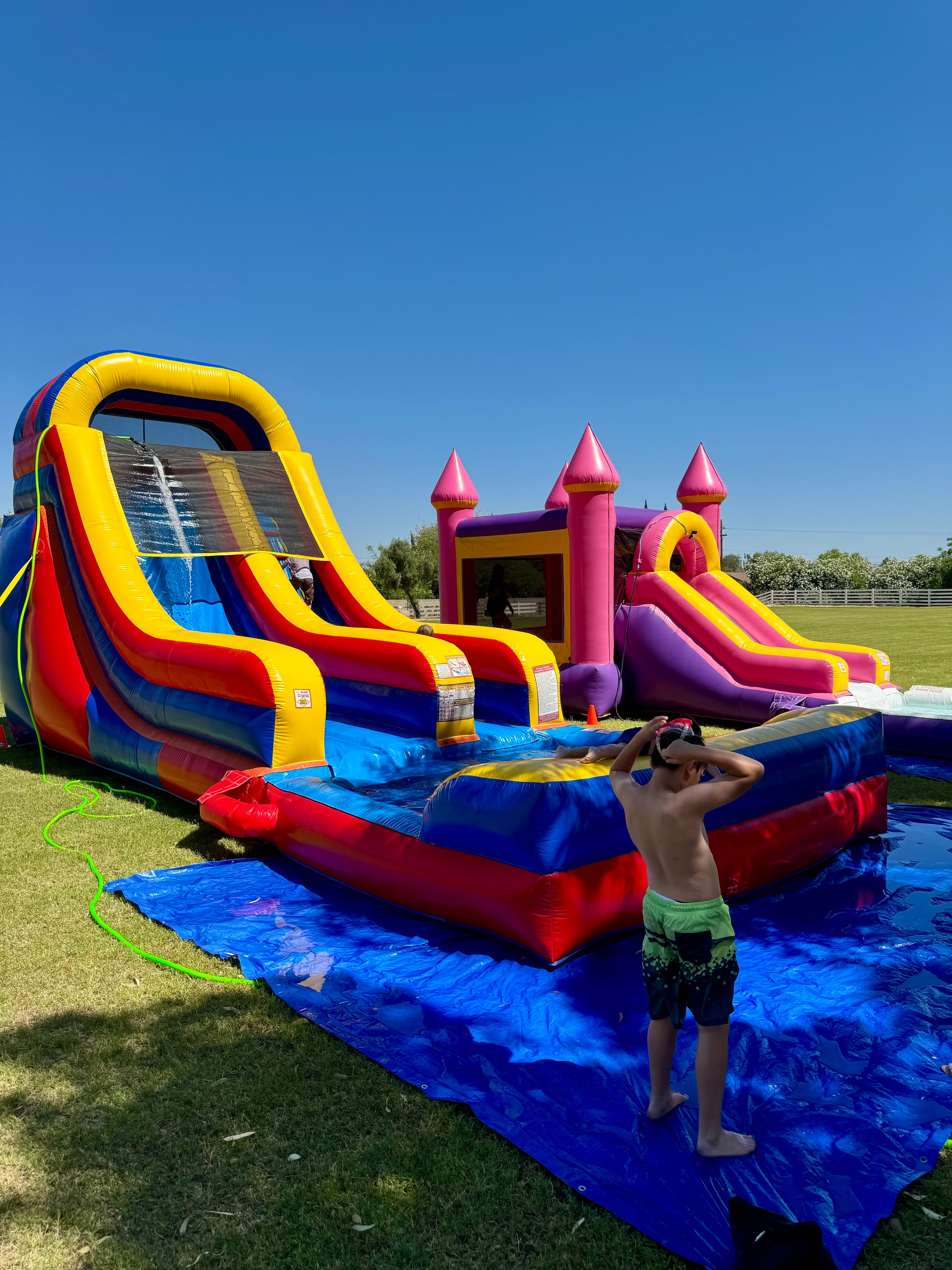 Colorful Play4Life bounce houses set up for an Arizona event